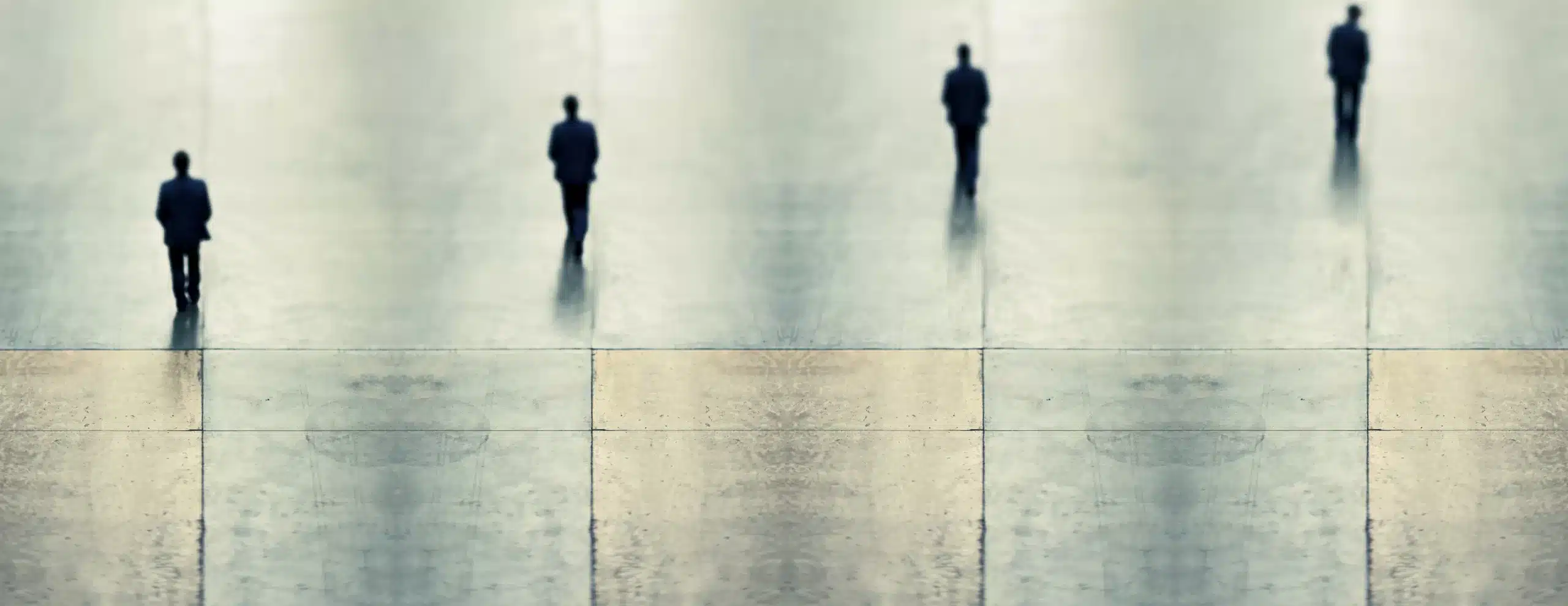 Experimental fine art photography featuring a digital composite of blurred figures in motion within the Tate Modern’s turbine hall, highlighting body language and spatial interaction.